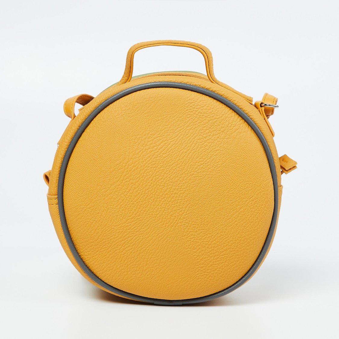 Buy BAGGIT Textured Circular Sling Bag from Baggit at just INR 1050.0