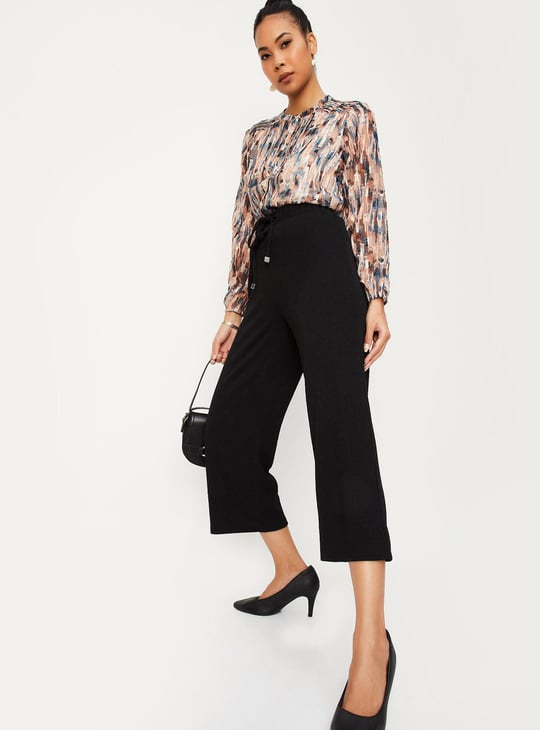 Women Textured Knit Flared Trousers