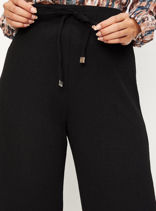Women Textured Knit Flared Trousers