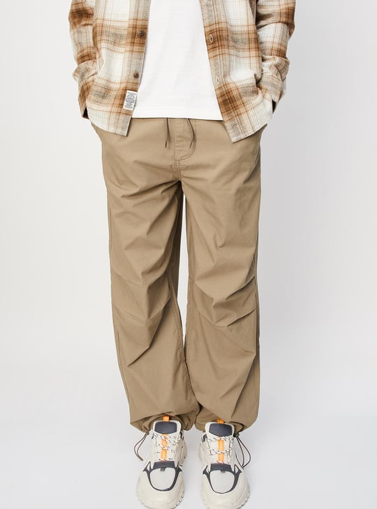 Men Solid Relaxed Fit Parachute Pants
