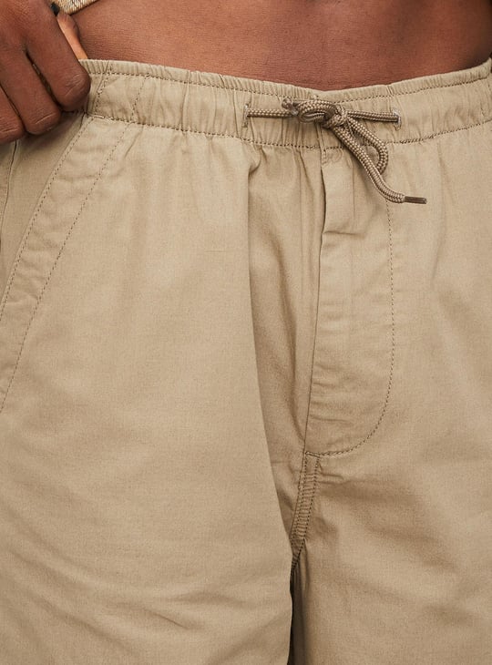 Men Solid Relaxed Fit Parachute Pants