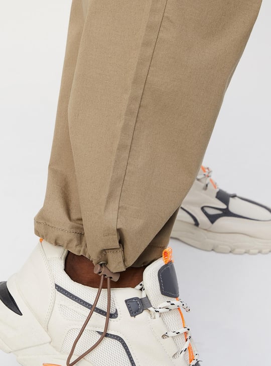 Men Solid Relaxed Fit Parachute Pants