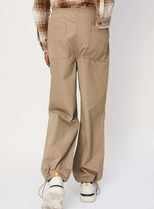 Men Solid Relaxed Fit Parachute Pants