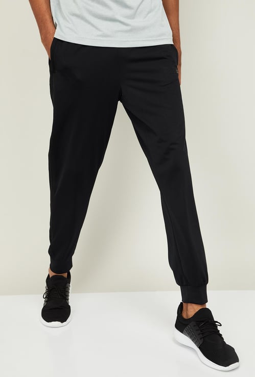 ADIDAS Men Solid Elasticated Regular Fit Joggers