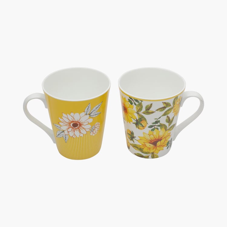 Clay Craft White And Yellow Printed Ceramic Mug - 330ml - Set of 2