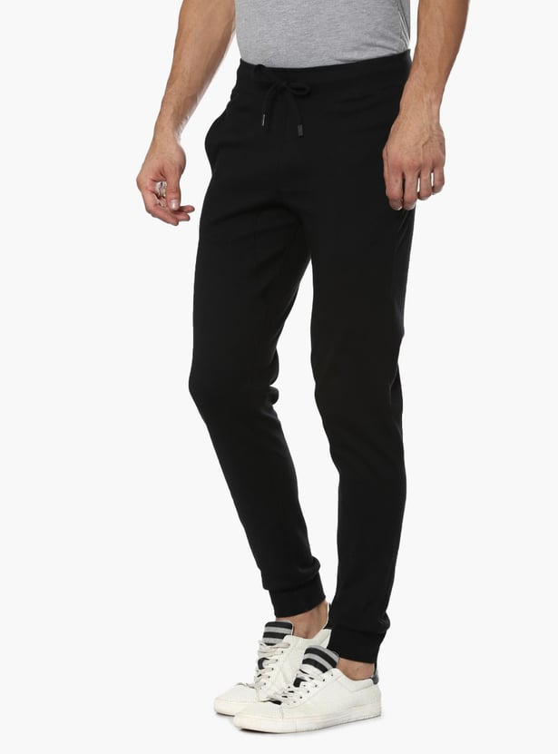 Buy FAHRENHEIT Solid Jogger Trackpants from Fahrenheit at just INR