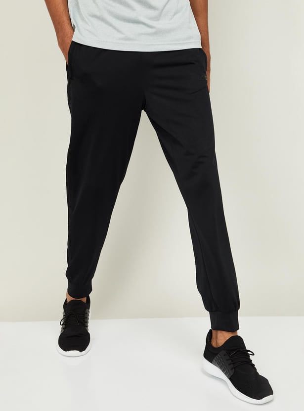 Buy ADIDAS Men Solid Elasticated Regular Fit Joggers from Adidas