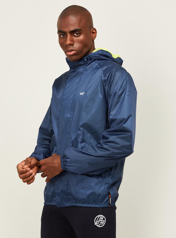 Buy WILDCRAFT Men Solid Hooded Rain Jacket from Wildcraft at just INR 1999.0