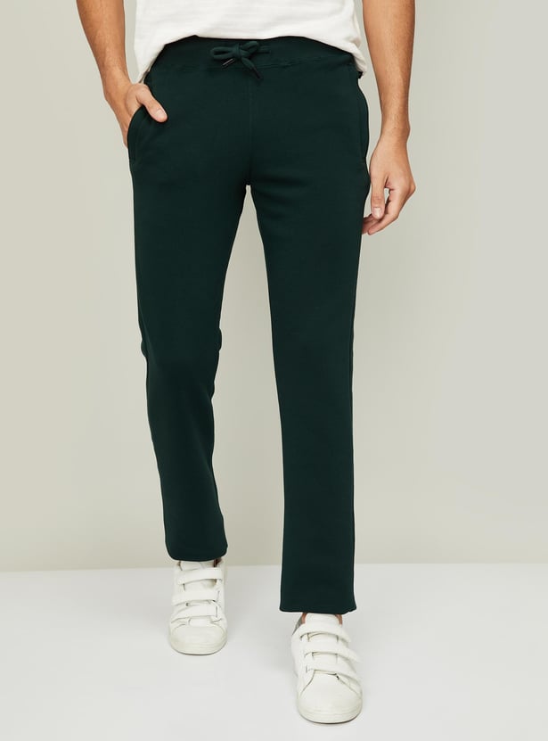 Buy FAHRENHEIT Men Solid Elasticated Track Pants from Fahrenheit at just INR 1595.0