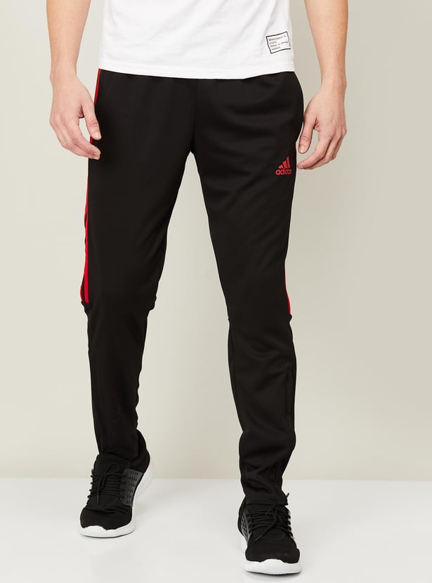 Buy ADIDAS Men Striped Elasticated Track Pants from Adidas at just