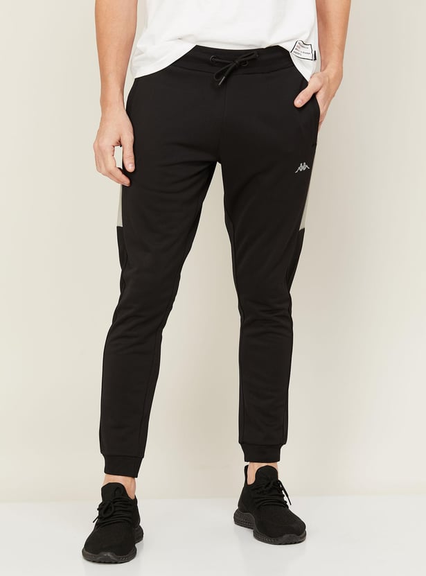 Buy KAPPA Men Solid Side Detailed Slim Fit Joggers from Kappa at just INR 1499.0