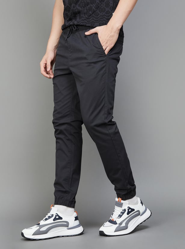 Buy FAME FOREVER Men Solid Slim Tapered Joggers from Fame Forever at ...