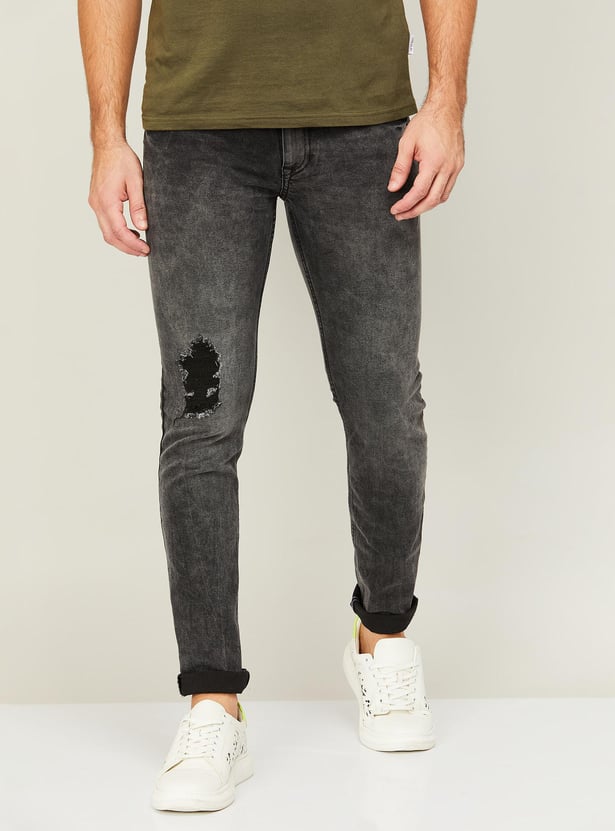 Buy FORCA Men Distressed Skinny Fit Jeans from Forca at just INR