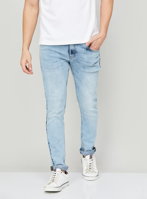 Buy BOSSINI Men Acidwashed Skinny Fit Jeans from Bossini at just INR 3499.0