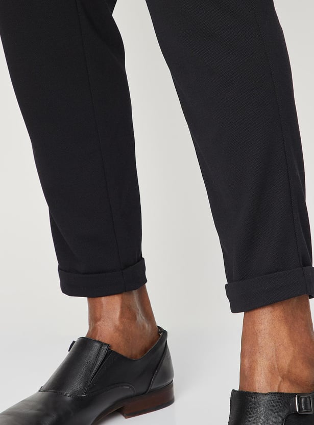 Men Solid Knit Carrot Fit Trousers