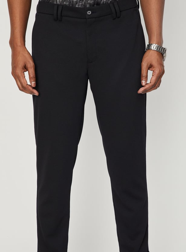 Men Solid Knit Carrot Fit Trousers
