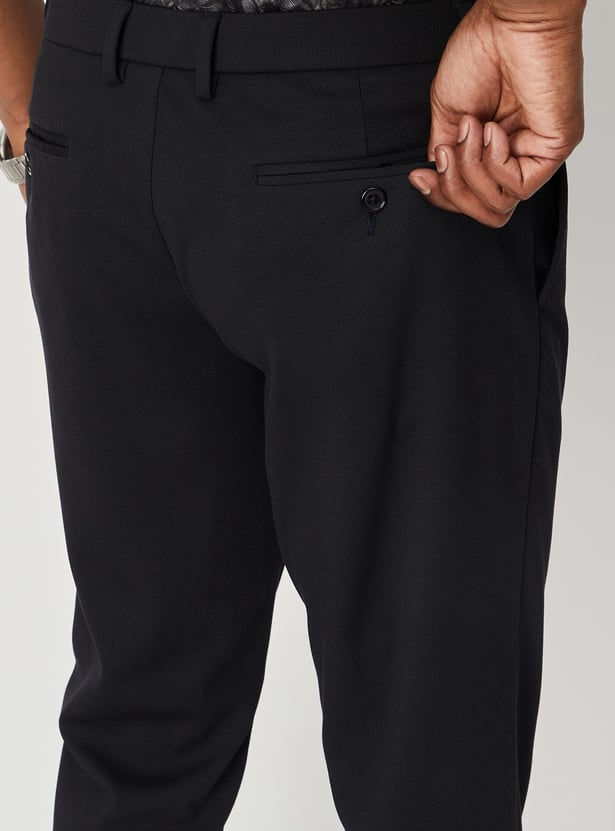 Men Solid Knit Carrot Fit Trousers