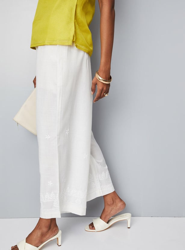 Women Solid Palazzos with Schiffli Detail