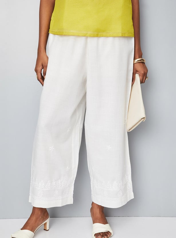 Women Solid Palazzos with Schiffli Detail