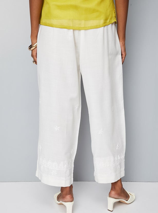 Women Solid Palazzos with Schiffli Detail