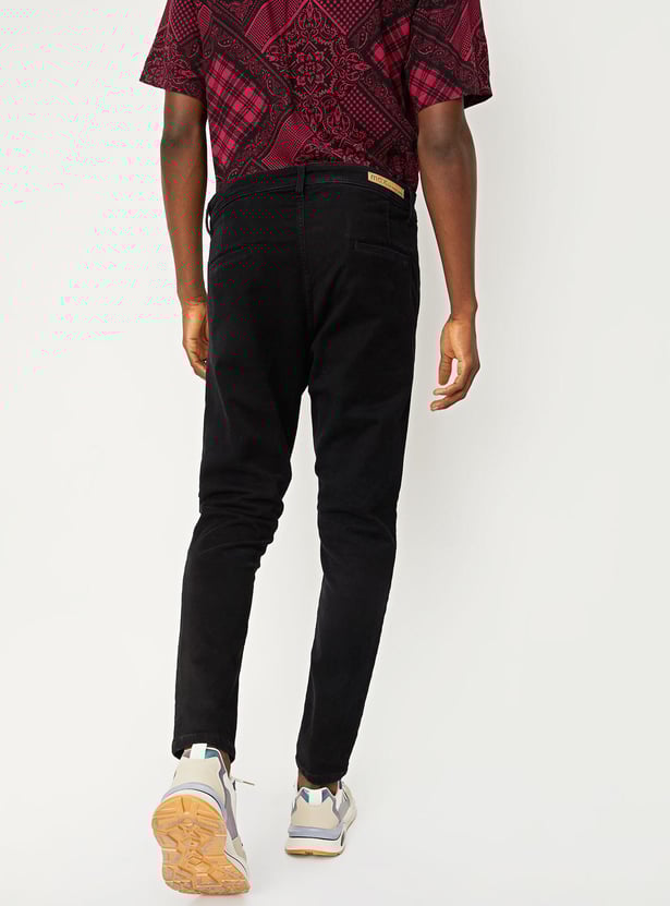 Buy Men Solid Carrot Fit Jeans Online at just Rs. 1499.0