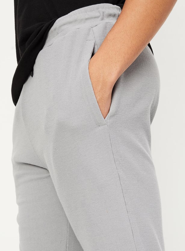 Buy Men Waffle Knit Track Pants Online at just Rs. 699.0